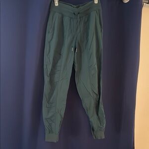 Women's Lululemon Green Dance Studio mid rise Joggers. Size 8